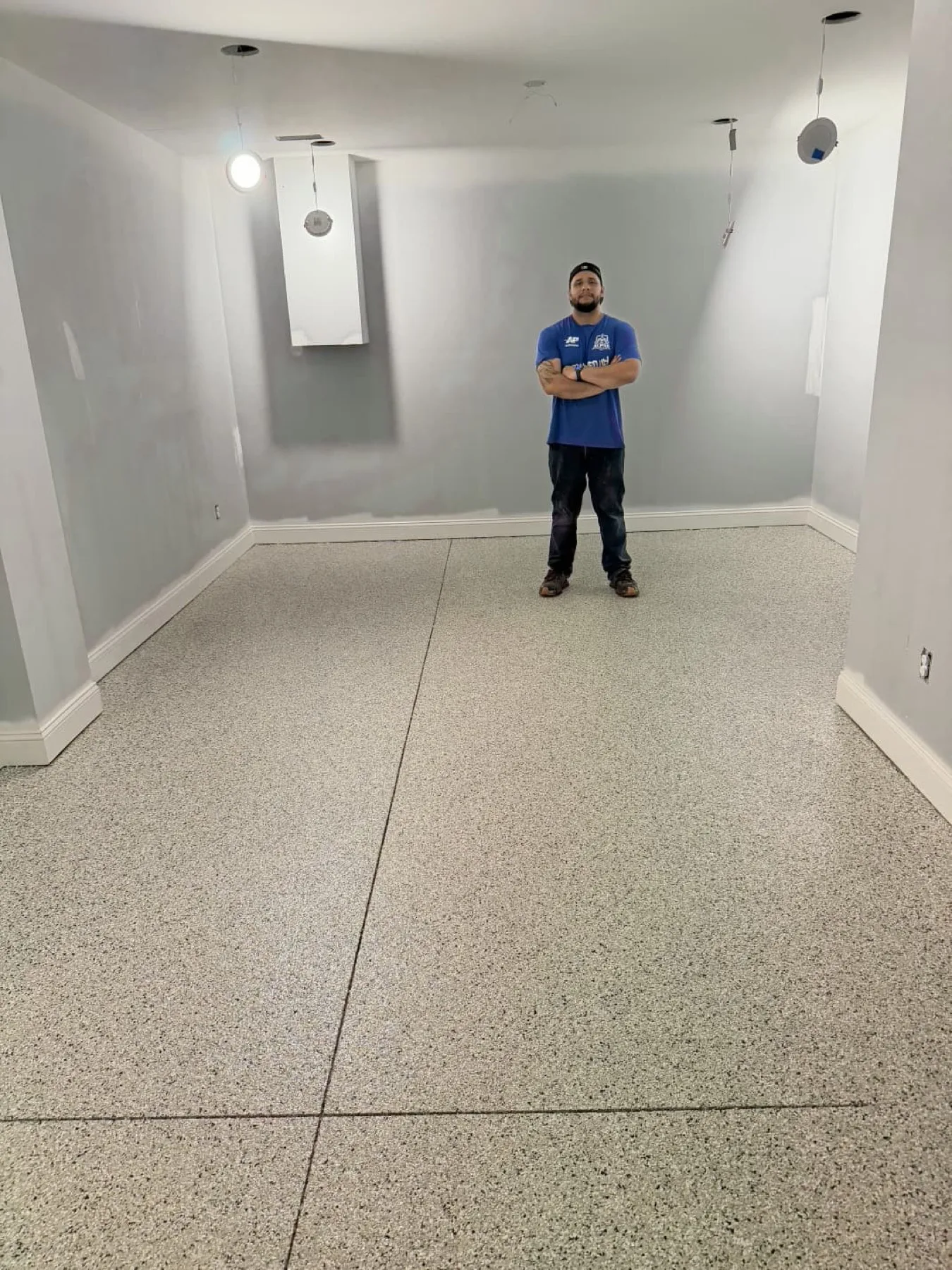 Beto Ponce of Alpha Resin in a finished flake floor room in Goldsboro, North Carolina
