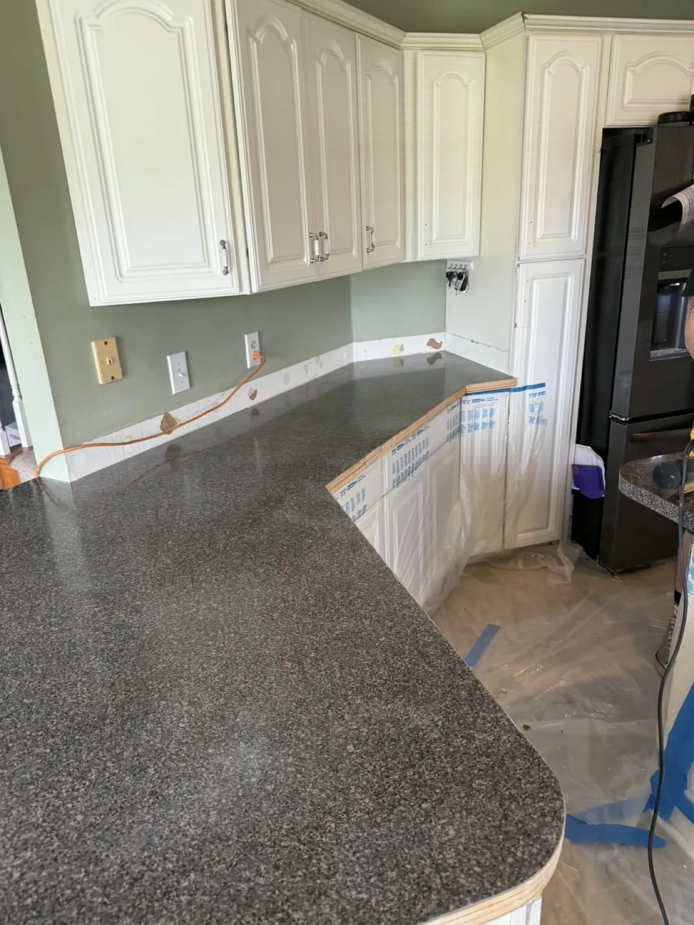 Kitchen counter masked off before an epoxy pour in Goldsboro, North Carolina