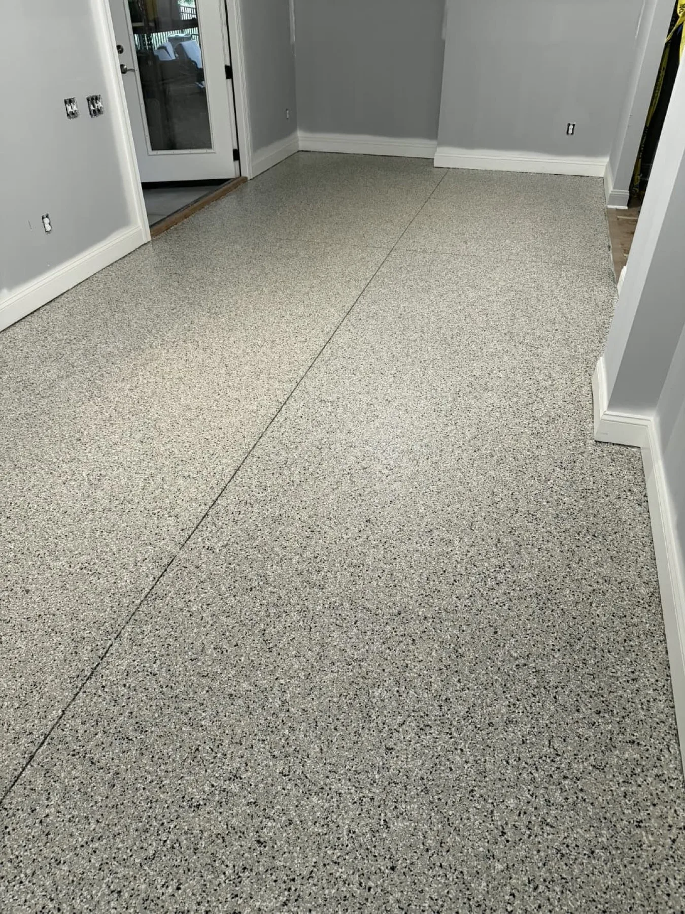 Gray flake epoxy floor in an interior hallway in Wayne County, North Carolina