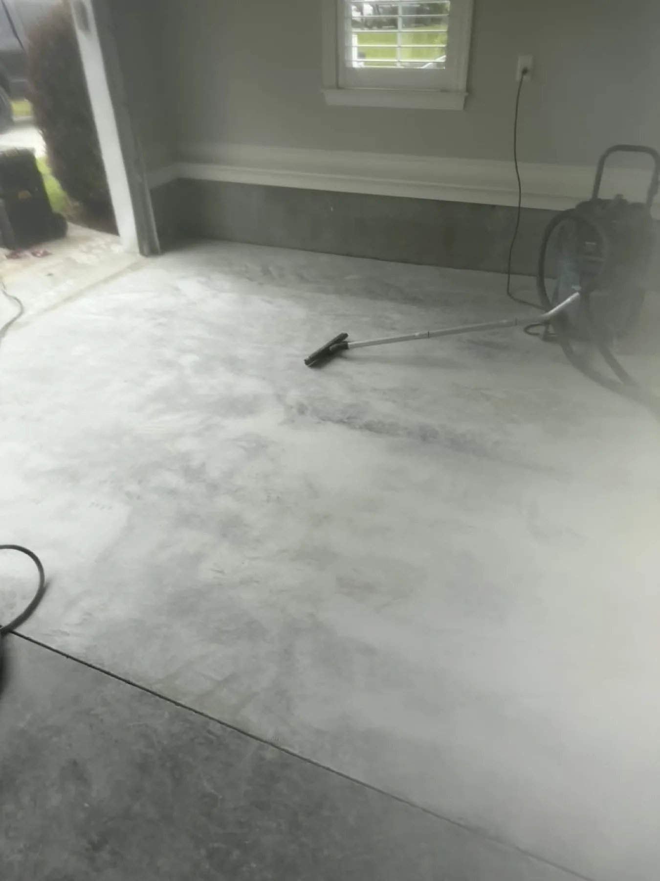 Gray metallic epoxy floor curing in a Wayne County, North Carolina home